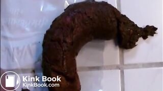 Woman shitting a long hard turd