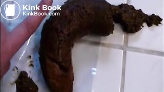 Woman shitting a long hard turd