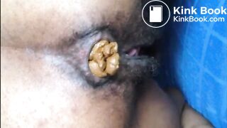 Hairy girl shitting an hard turd