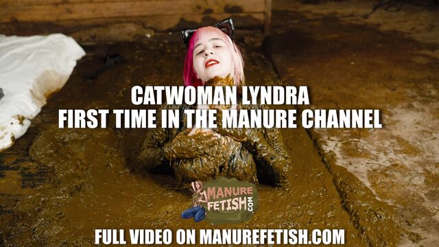 Catwoman Lyndra masturbates in cowshit