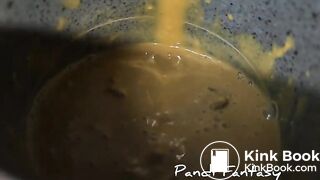 Pissing out of ass in cup