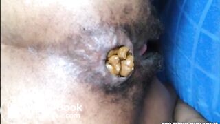 Hairy asshole ebony shitting closeup