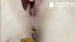 Shaved girl shitting closeup and fingering her pussy