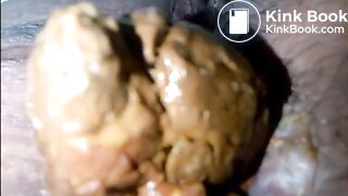 Hairy woman asshole and cunt shitting closeup