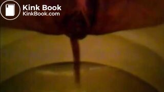 Girl shitting in the toilet and inserting dildo on her asshole