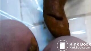 Woman shitting a long hard turd