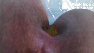 Woman shitting a long hard turd
