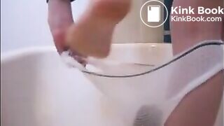 Girl shit and piss on white panty in the bathtub