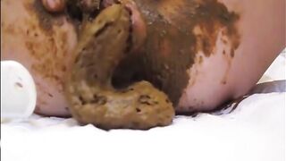 Mature lady masturbating with brush and shitting