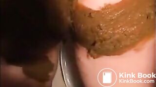 Woman shitting and smearing shit on her body
