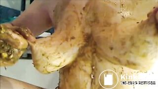 Big woman is smearing shit on her breast