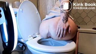 Tatted Girl shitting over toilet