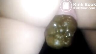 Woman showing large turd closeup