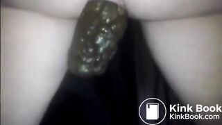 Woman showing large turd closeup