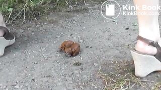 Girl does a big poop on a country lane