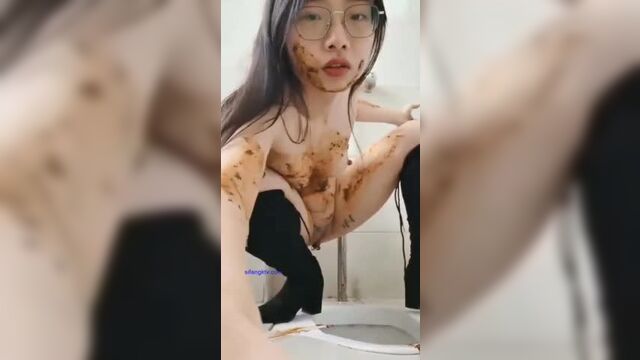 Sexy Chinese scat girl licking shit from the public toilet