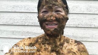 Asian woman smiles covered in scat