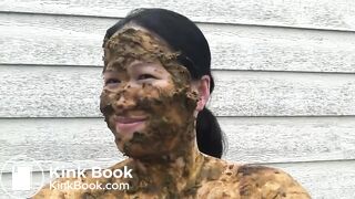 Asian woman smiles covered in scat