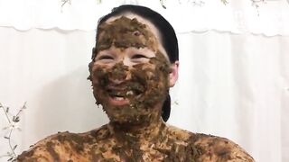 Asian woman laughs covered in scat