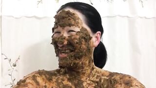 Asian woman laughs covered in scat