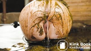 Catwoman Lyndra plays in cowshit