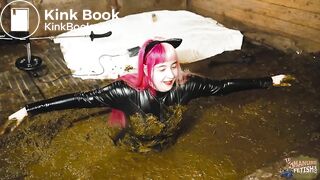 Catwoman Lyndra plays in cowshit