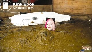 Catwoman Lyndra plays in cowshit