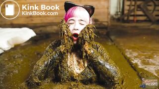 Catwoman Lyndra plays in cowshit