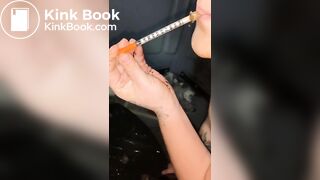 Syringe covered in shit for worthless human toilet