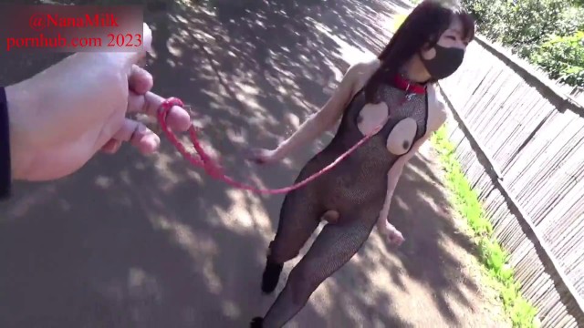 Walking in a large park wearing body stockings and a collar, half-naked.