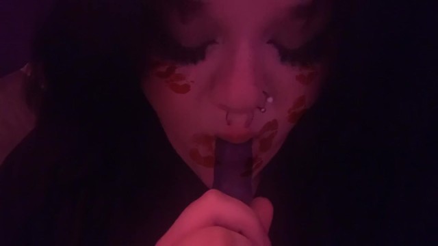 Goth babe sucking toy