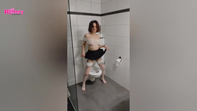 Party girl pees in the toilet