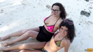 Busty stepmom and stepdaughter got golden showers instead of tanning on a public beach