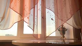 Girl shitting huge log on table
