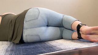 Tied up girl can’t hold it anymore pees in light jeans