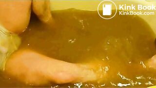 pooping in white brief in bathtub