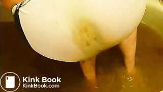 pooping in white brief in bathtub