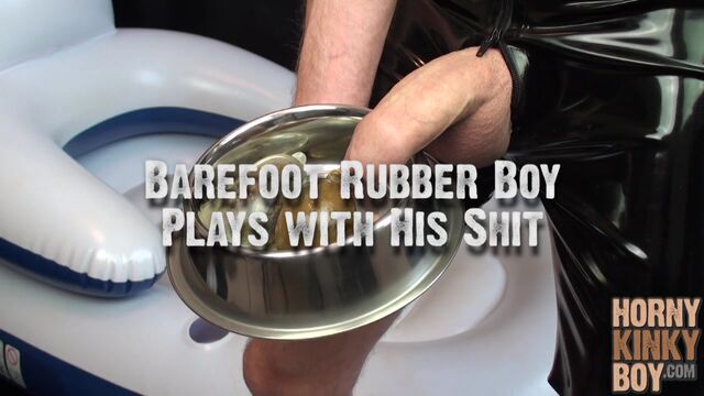 Barefoot Rubber Boy Plays with His Shit