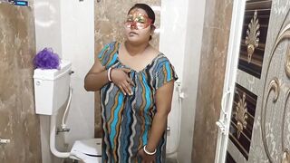 Gorgeous Indian aunty masterbating and pissing herself in bathroom .