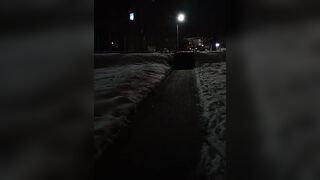Snowy pissing in mouth behind shopping center