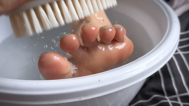 Friend scrubs my feet and gives it a bath. Feet worship