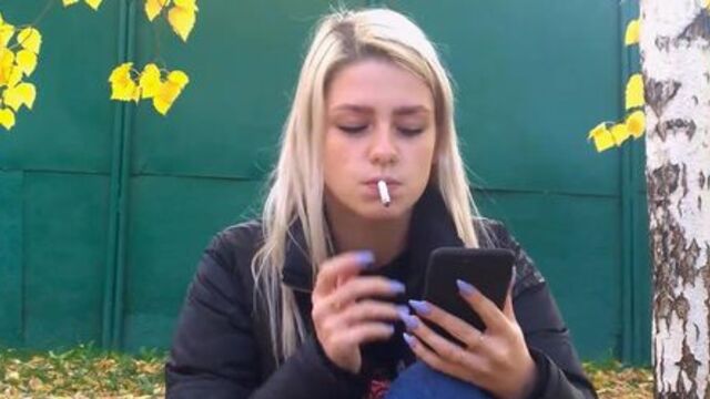 Gorgeous young blonde smoking sexy