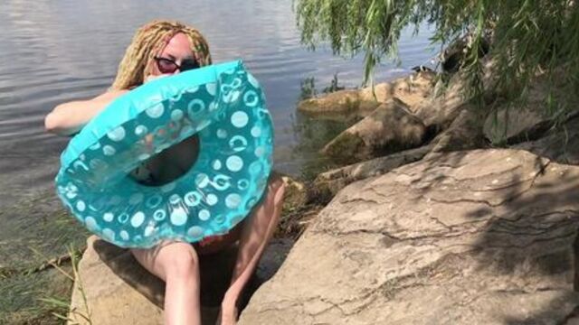 Inflating a swimming ring on the lake