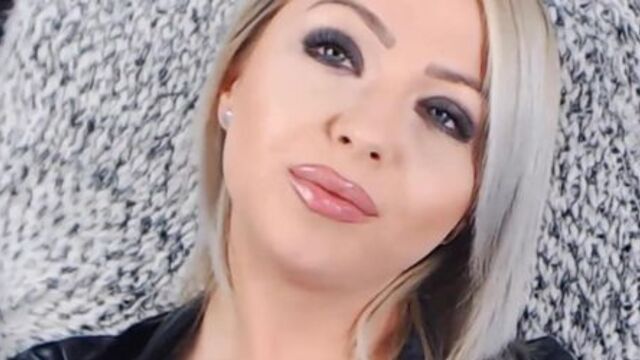 blonde mistress glossy lips tease and smoking in leather (face close up)