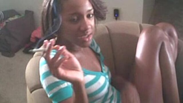 Ebony girl Kiki smoking a cigarette