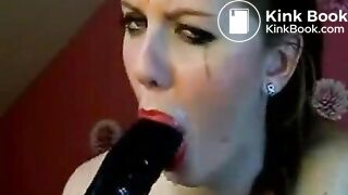 Hot chick makes herself gag on a big toy