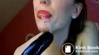 Hot chick makes herself gag on a big toy