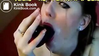 Hot chick makes herself gag on a big toy