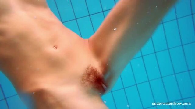 Marusia shows you her hairy sweet vagina in the pool