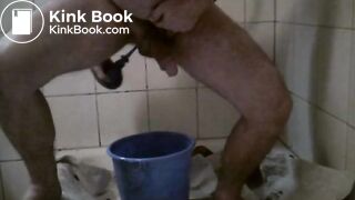 chubby gay guy smearing poop from a tub